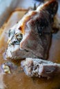 Baked delicious fat pork meat seasoned with salt, papper, garlic and rosemary branches Royalty Free Stock Photo