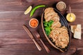 Baked dish of beef, noodles, rice, mushrooms, onions served with butter Royalty Free Stock Photo