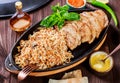 Baked dish of beef, noodles, rice, mushrooms, onions served with butter Royalty Free Stock Photo