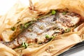 Baked dorado fish in parchment