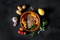 Baked dorado with fresh salad and vegetables on the plate.