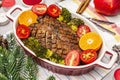 Baked duck breast on the bone with vegetables and sauce. Christmas dinner concept, New Year table setting. Stone concrete