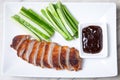 Baked duck with hoisin sauce, cucumbers and shallots. Royalty Free Stock Photo