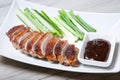 Baked duck with hoisin sauce, cucumbers and shallots. Royalty Free Stock Photo