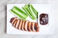 Baked duck with hoisin sauce, cucumbers and shallots. Royalty Free Stock Photo