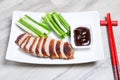 Baked duck with hoisin sauce, cucumbers and shallots. Royalty Free Stock Photo