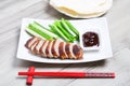 Baked duck with hoisin sauce, pancakes, cucumbers and shallots. Royalty Free Stock Photo