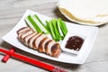 Baked duck with hoisin sauce, pancakes, cucumbers and shallots. Royalty Free Stock Photo