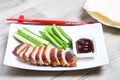 Baked duck with hoisin sauce, pancakes, cucumbers and shallots. Royalty Free Stock Photo