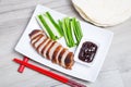 Baked duck with hoisin sauce, pancakes, cucumbers and shallots. Royalty Free Stock Photo