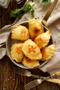 Baked dumplings stuffed with curd cheese and potatoes in a pan Royalty Free Stock Photo