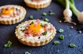 Baked egg and bacon tartlets