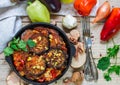 Baked eggplant with peppers, garlic, tomatoes and walnuts. Cold or hot appetizer