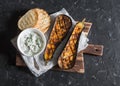 Baked eggplant with tzaziki sauce on dark background Royalty Free Stock Photo