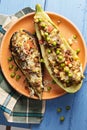 Baked eggplant and zucchini boats above view