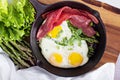 Baked eggs with asparagus and bacon