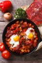 Baked eggs with chorizo and vegetables close up top view Royalty Free Stock Photo