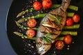 Baked fish with asparagu in the plate