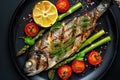 Baked fish with asparagu in the plate