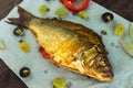 Baked fish carp, stuffed bell peppers and grapes Royalty Free Stock Photo