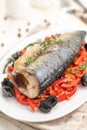 Baked fish mackerel with vegetables, sweet pepper and black olives and herbs Royalty Free Stock Photo