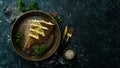 Baked flounder fish with lemon and spices on a metal baking dish. Seafood. Top view.