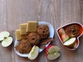 Top view. Baked and fresh apples, shortbred biscuits on rustic style oak wood background. Light bio organic breakfast. Royalty Free Stock Photo
