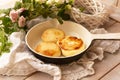 Baked fried cottage cheese pancakes in a white vintage pan