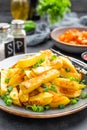 Baked, fried potato on plate on table