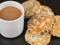 Baked Fruit Welsh Cakes With a Mug of Tea or Coffee Royalty Free Stock Photo