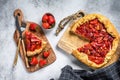 Baked galette with strawberry and rhubarb. Homemade pie, tarte. Gray background. Top view Royalty Free Stock Photo