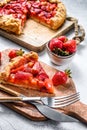 Baked galette with strawberry and rhubarb. Homemade pie, tarte. Gray background. Top view Royalty Free Stock Photo