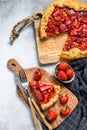 Baked galette with strawberry and rhubarb. Homemade pie, tarte. Gray background. Top view Royalty Free Stock Photo