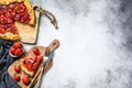 Baked galette with strawberry and rhubarb. Homemade pie, tarte. Gray background. Top view. Copy space Royalty Free Stock Photo