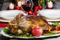 Baked goose on wooden table