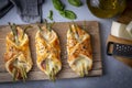 Baked green asparagus with ham and cheese in puff pastry sprinkled with sesame seeds and green basil leaves Royalty Free Stock Photo