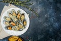Baked green mussels with parmesan and garlic croutons on a white