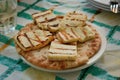 Baked grilled cheese on a plate with a tortilla