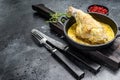 Baked hare Haunches in Pan with Stewed Vegetables. Black background. Top view. Copy space