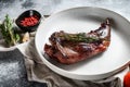 Baked hare leg with herbs, served on textile napkin. Organic meat. Top view