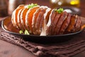 Baked hasselback potato with sour cream Royalty Free Stock Photo