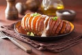 Baked hasselback potato with sour cream Royalty Free Stock Photo