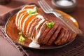Baked hasselback potato with sour cream Royalty Free Stock Photo