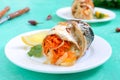 Baked herring stuffed with vegetables. Tasty fish rolls Royalty Free Stock Photo