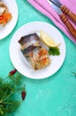 Baked herring stuffed with vegetables. Tasty fish rolls. The top view Royalty Free Stock Photo