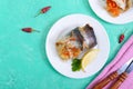 Baked herring stuffed with vegetables. Tasty fish rolls. The top view Royalty Free Stock Photo