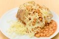 Baked Jacket Potato Filled With Beans And Cheese