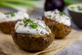 Baked jacket potatoes stuffed with curd and spring onion