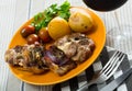 Baked lamb leg chops with potatoes, tomatoes, greens Royalty Free Stock Photo