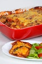 Baked aubergine and tomato topped with cheese.